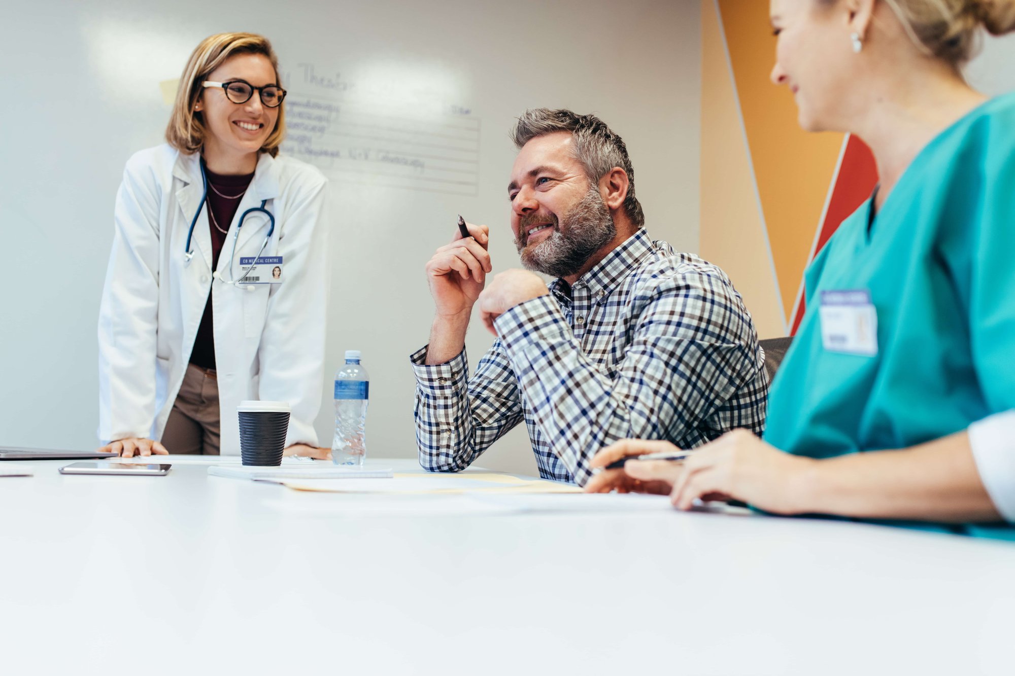 Healthcare leadership discussing healthcare software