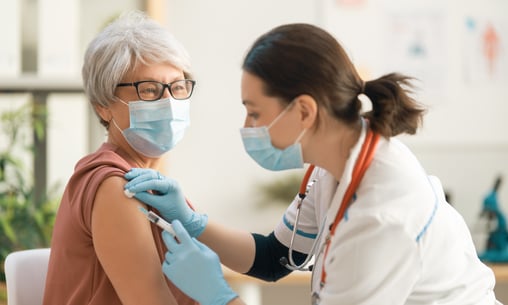 Doctor giving immunizations for public health