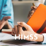 Someone holding an open book. HIMSS Study. 