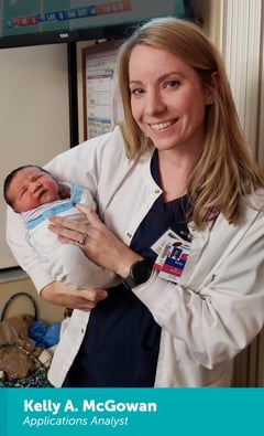 Kelly A. McGowan holding a newborn