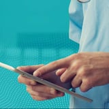 Clinician using EHR software on a tablet