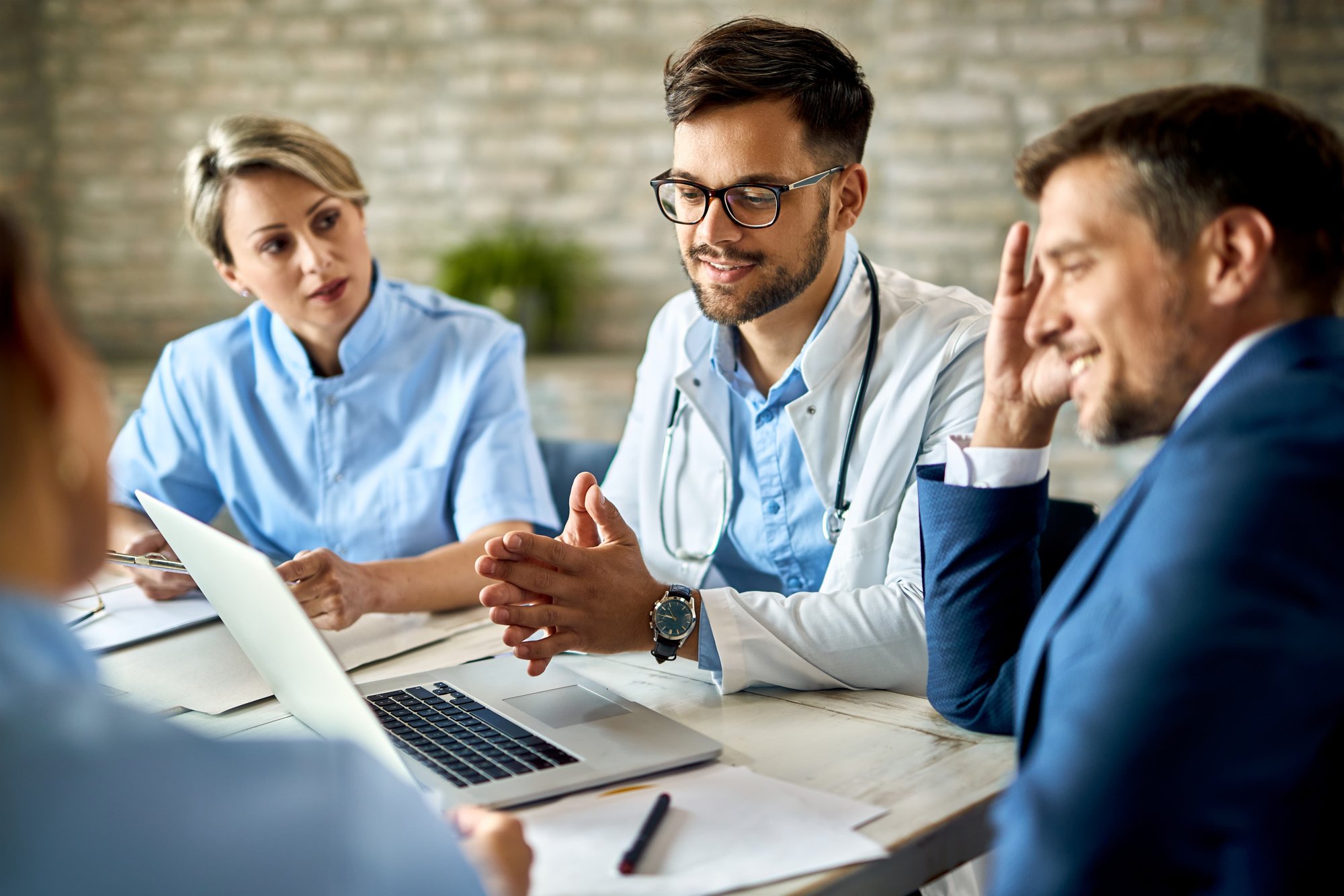 Chief medical officer meeting with clinical team to evaluate the current EHR